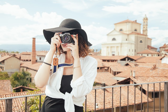 girl using camera-Traveling Alone as a Woman